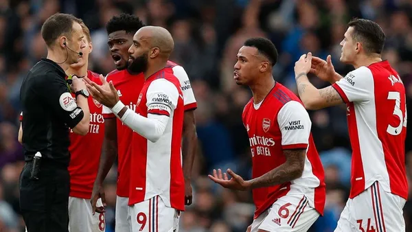 A large amount of money was wagered on an Arsenal player receiving a yellow card in a match, which is being investigated.