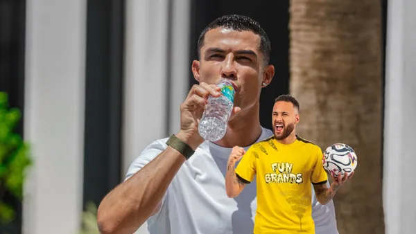Cristiano Ronaldo drinks water while Neymar celebrates with a ball on his hand.