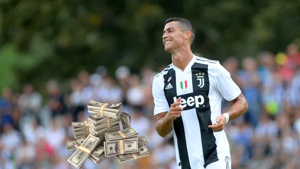 Cristiano Ronaldo happy wearing a Juventus FC shirt.