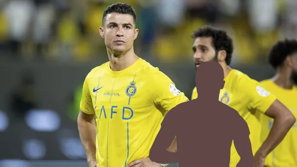 Cristiano Ronaldo puts his hand on his hips while wearing the Al Nassr jersey and a mystery player is below him.