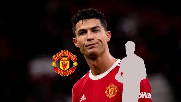 Cristiano Ronaldo squints his eyes as he wears the Manchester United jersey while the Man United badge is next to a mystery player. (Source: Getty Images)
