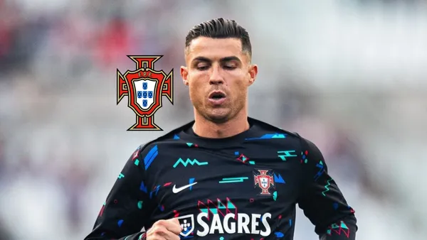 Cristiano Ronaldo takes a deep breath while wearing a Portugal training kit; the Portugal national team badge is next to him.