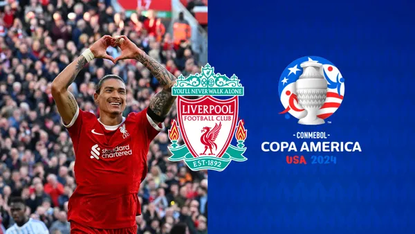 Darwin Nuñez celebrates a Liverpool goal with a heart gesture, the Copa America 2024 Logo is next to him and the Liverpool badge is in the middle.
