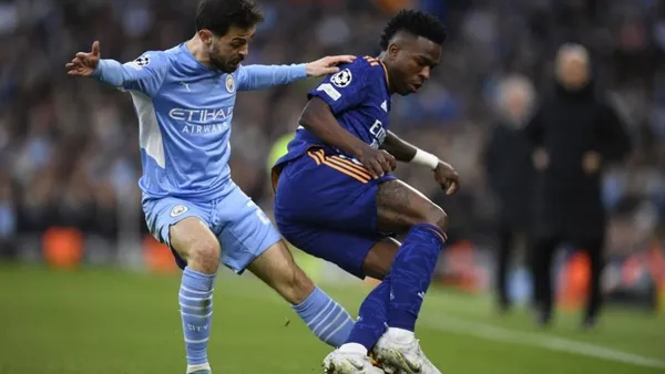 De Bruyne, Jesus, Foden and Silva scored for the home team. Benzema, twice, and Vinicius Jr. scored for the Spanish side.