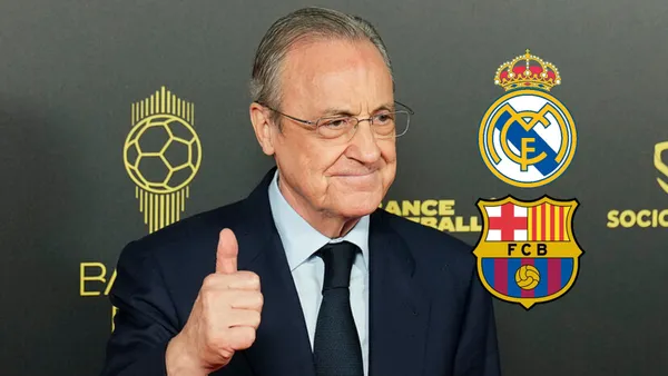 Florentino Perez gives a thumbs up and smiles while the badges of Real Madrid and FC Barcelona are next to him.