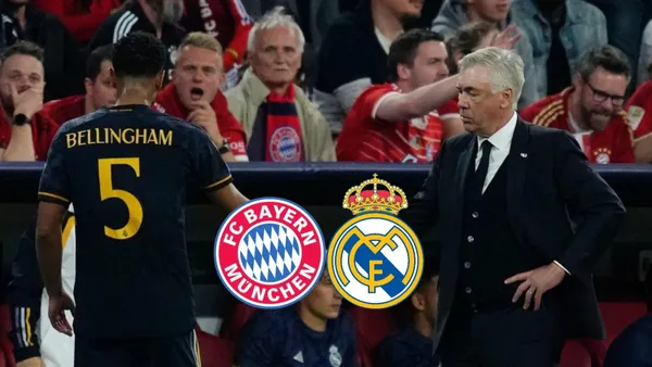 Jude Bellingham walks to the bench and shakes Carlo Ancelotti's hand.