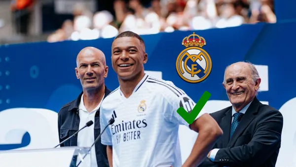 Kylian Mbappé smiles in a Real Madrid jersey as the Real Madrid badge and a check sign is next to him. (Source: Madrid Xtra X)