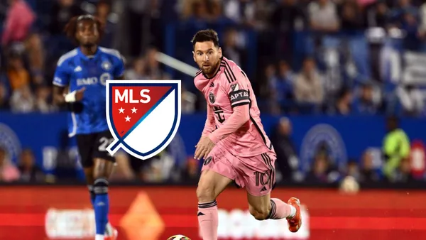 Lionel Messi dribbling on the pitch while wearing the Inter Miami pink kit vs CF Montreal.