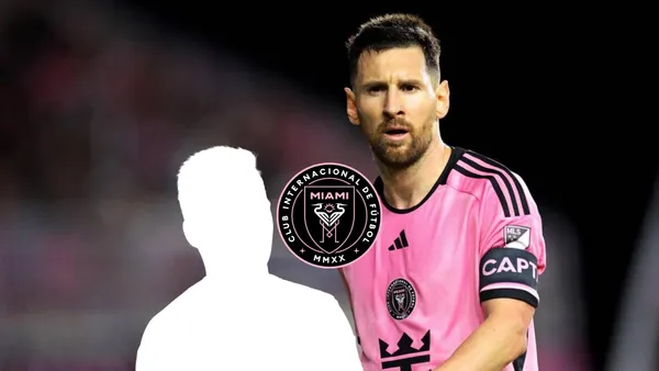 Lionel Messi looks at his teammates while he is wearing an Inter Miami jersey.