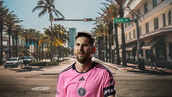 Lionel Messi looks confused with Inter Miami with the background on the Miami streets.