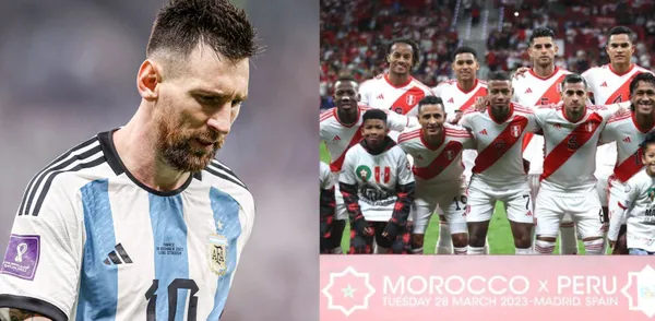 Lionel Messi looks down as he wears the Argentina jersey while the Peru team pose for a team picture.