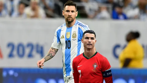 Lionel Messi looks serious with the Argentina jersey on while Cristiano Ronaldo seems disappointed with a Portugal jersey on. (Source: Messi Xtra, GOATTWORLD X)