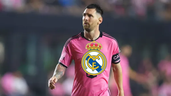 Lionel Messi looks up while wearing an Inter Miami jersey and the Real Madrid badge is below him.