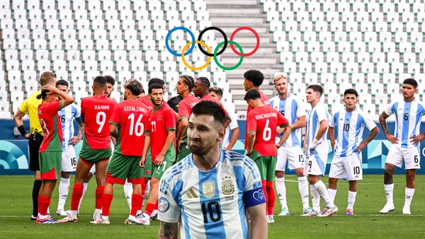 Lionel Messi looks upset with the Argentina jersey while the Morocco and Argentina players are on the pitch with no fans. (Source: BR Football)