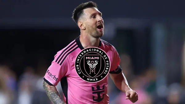 Lionel Messi shouts while wearing an Inter Miami jersey and the Inter Miami badge is in the middle.
