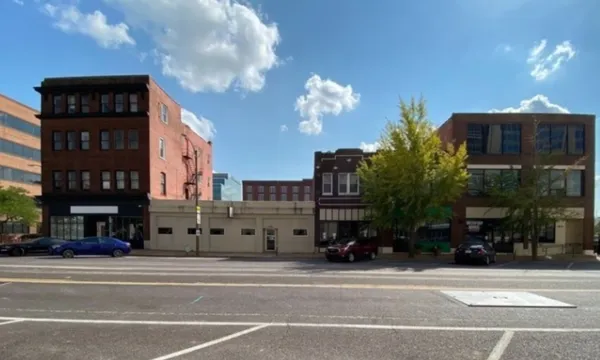 MLS team's plan to demolish buildings near stadium site for parking is is waking up the anger among the neighbors.