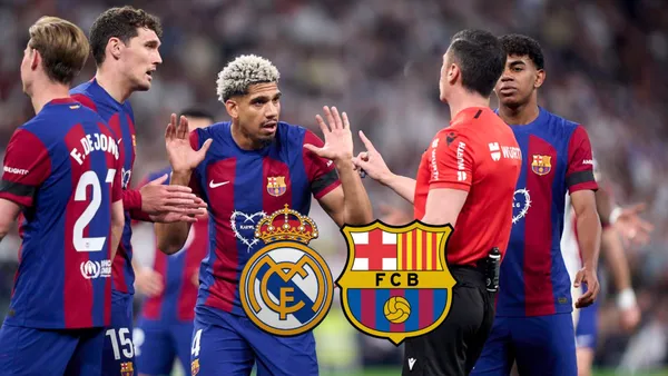 The FC Barcelona players argue with the referee in the match against Real Madrid.