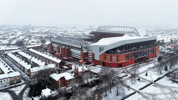 The Reds' stadium pitch is affected by snowfall just moments before the England derby is due to take place