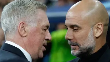 Carlo Ancelotti and Pep Guardiola speak to each other after the game.