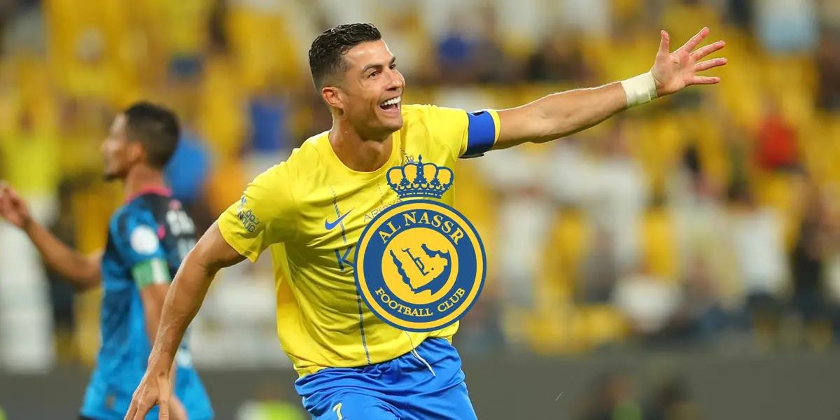 Cristiano Ronaldo celebrates his Al Nassr goal with his arm out while wearing the Al Nassr jersey.