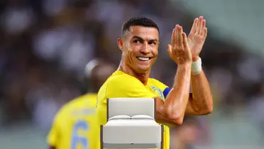 Cristiano Ronaldo claps his hands while playing for Al Nassr on the pitch.