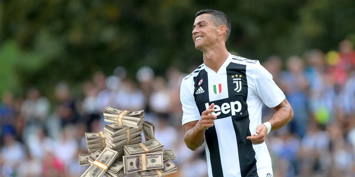 Cristiano Ronaldo happy wearing a Juventus FC shirt.