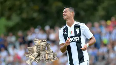 Cristiano Ronaldo happy wearing a Juventus FC shirt.