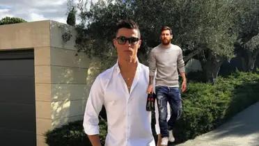 Cristiano Ronaldo poses with a white shirt and sunglasses while Lionel Messi wears a long sleeve shirt and jeans.