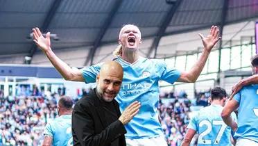 Erling Haaland celebrates his goals for Manchester City while Pep Guardiola smiles.