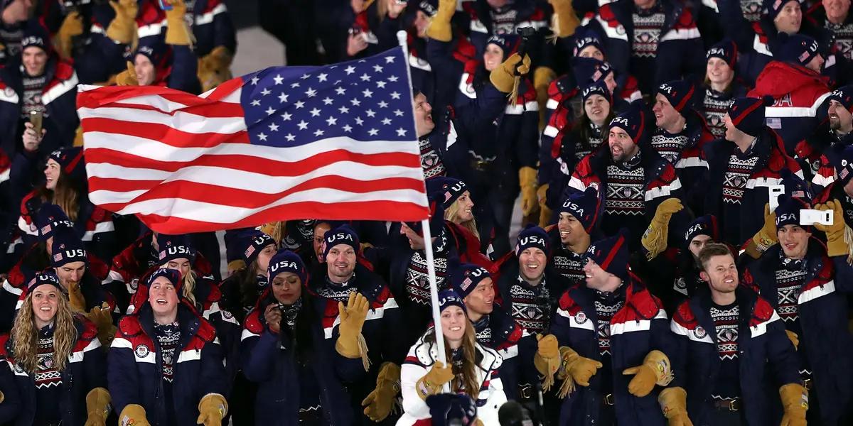 How does the United States of America and Japan compare in how much they pay for each medal at the Olympics?