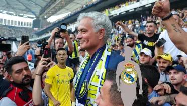 Jose Mourinho smiles with the Fenerbache fans while Cristiano Ronaldo looks concerned and a mystery player has the Real Madrid badge on him.