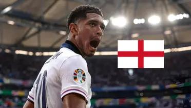 Jude Bellingham shouts with joy as he wears the England jersey and the England flag is next to him. (Source: Madrid Xtra X)