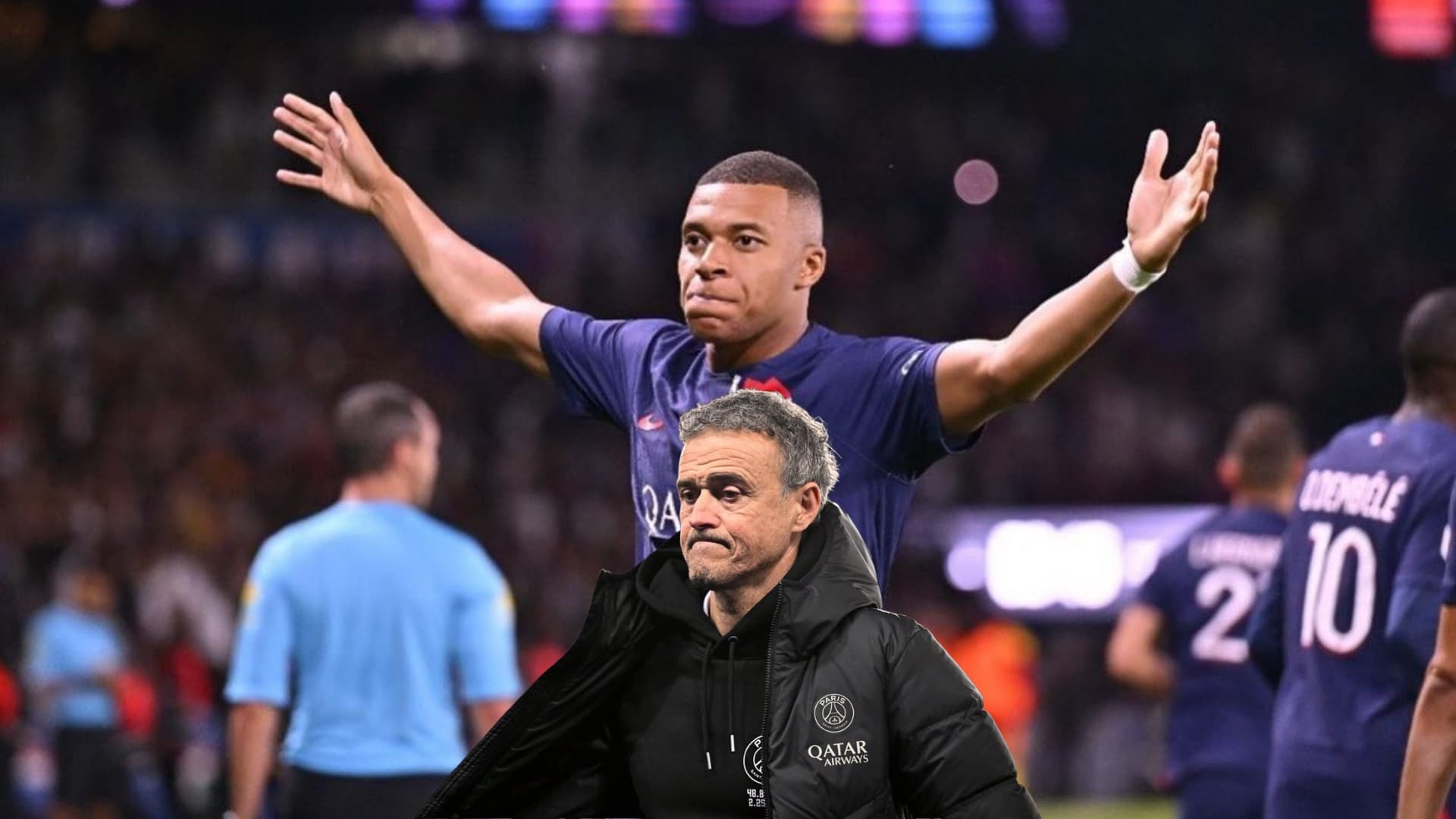 Kylian Mbappé raises his arms out as his goal celebration with PSG while Luis Enrique looks concerned wearing a PSG jacket.