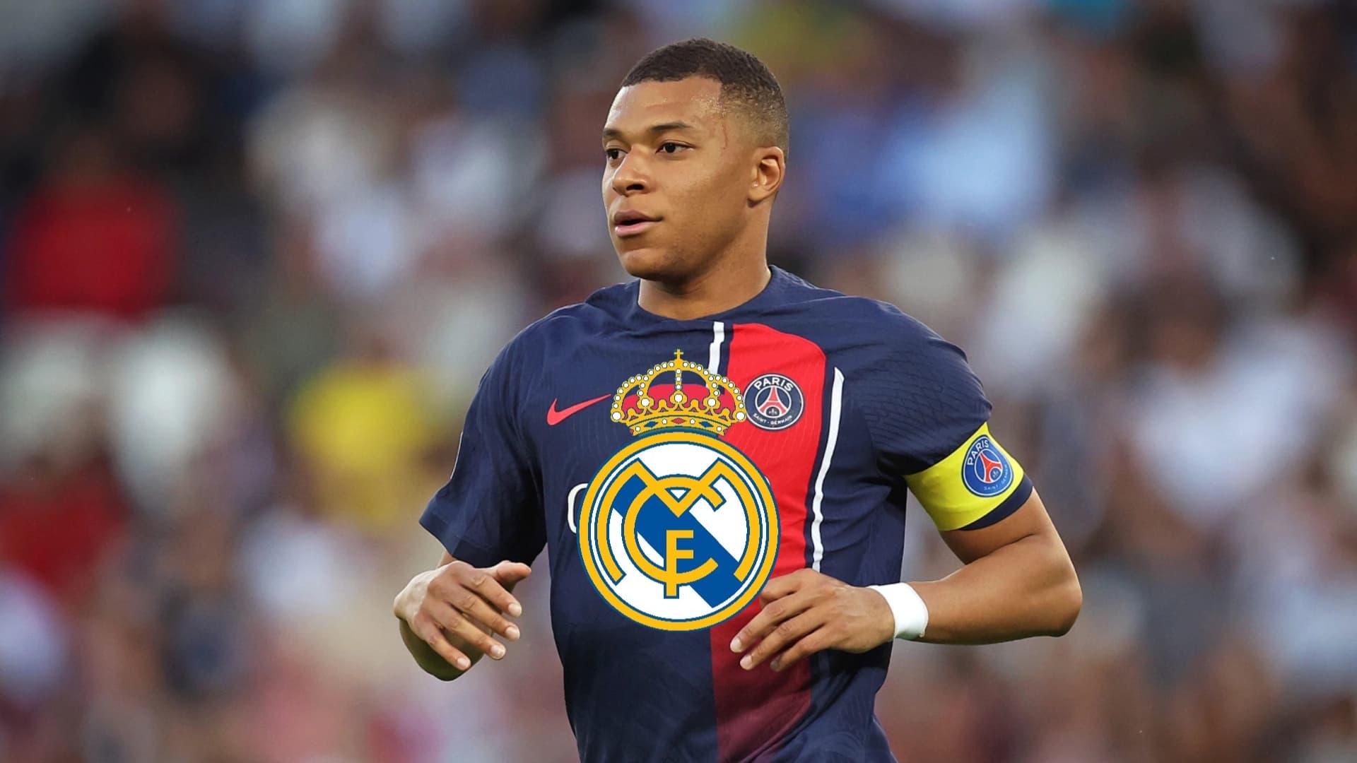 Kylian Mbappé sweating with a PSG jersey on and with the captain armband.