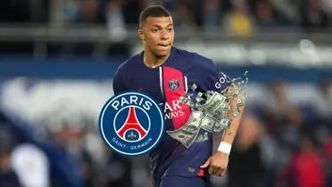 Kylian Mbappé wearing the PSG jersey as he looks at the pitch.
