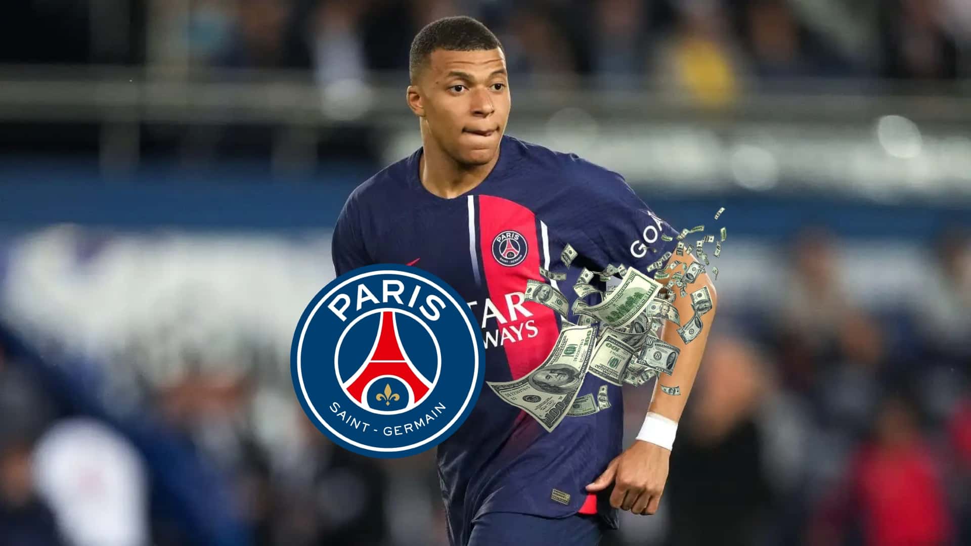 Kylian Mbappé wearing the PSG jersey as he looks at the pitch.