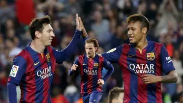 Lionel Messi and Neymar celebrating a goal together at FC Barcelona while Rakitic runs.