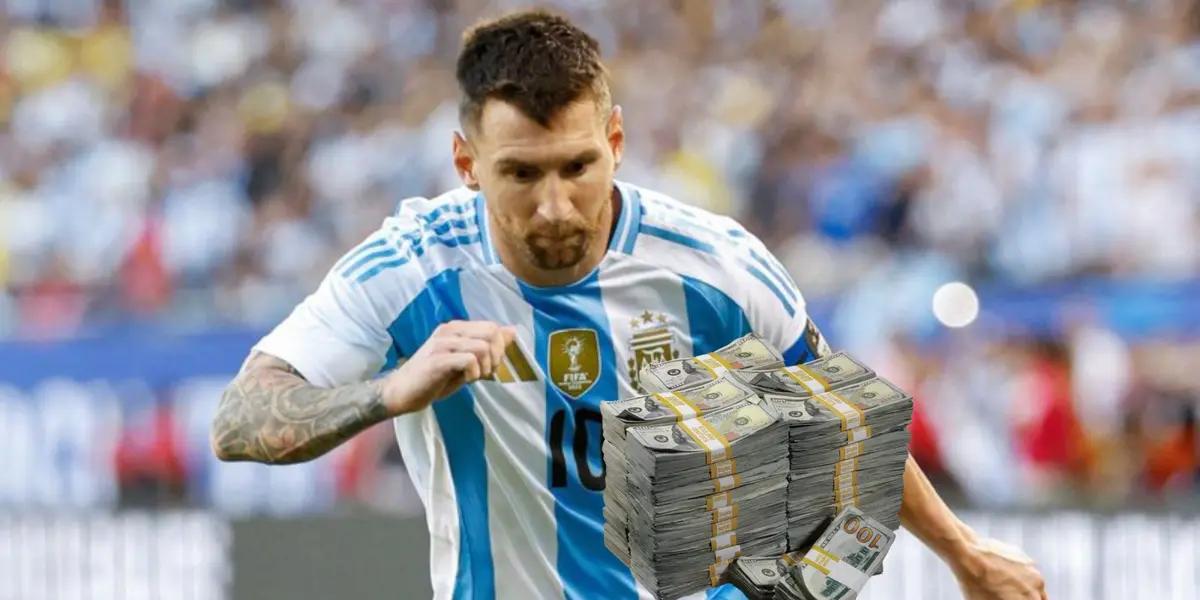 Lionel Messi looks down as he wears the Argentina national team jersey and a stack of cash is below him.