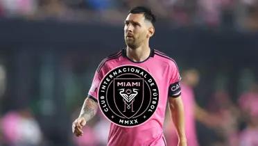Lionel Messi looks up while wearing an Inter Miami jersey and an Inter Miami badge in the middle.