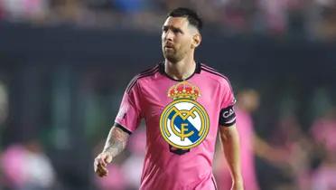 Lionel Messi looks up while wearing an Inter Miami jersey and the Real Madrid badge is below him.