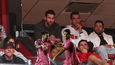 Lionel Messi, Sergio Busquets, and Jordi Alba watching an NBA game in Miami.