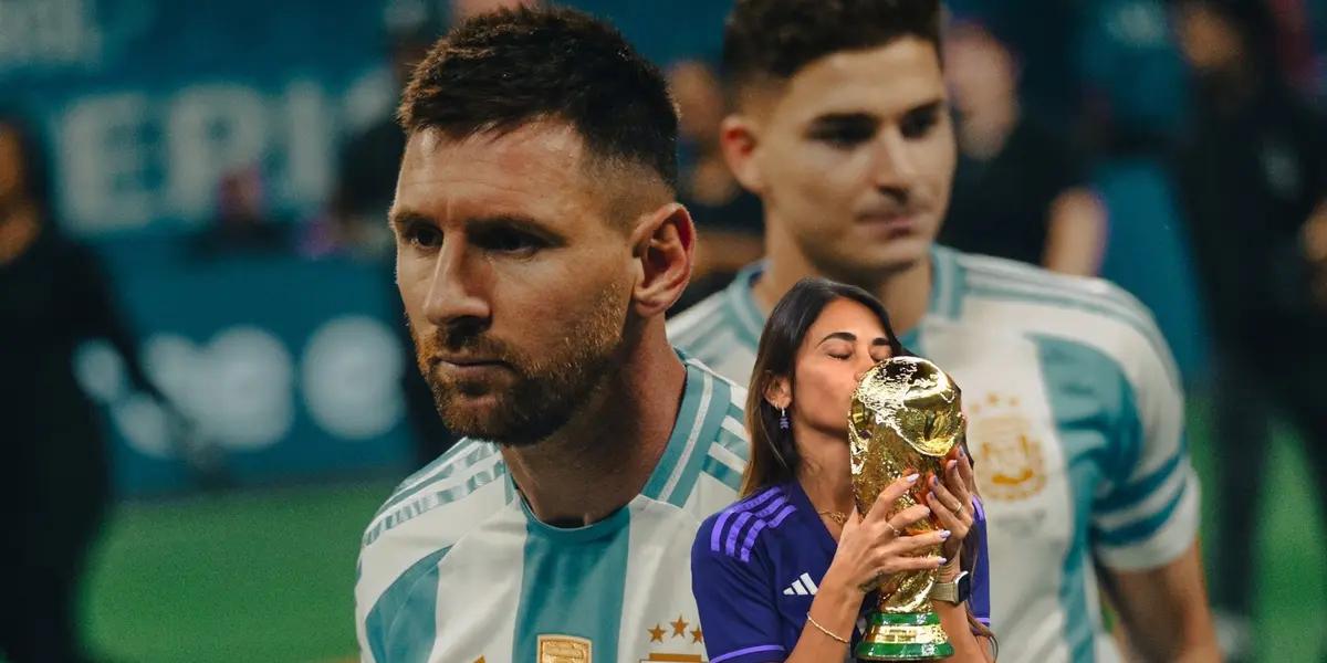 Lionel Messi wears the Argentina jersey and Antonella Roccuzzo kisses the World Cup trophy. (Source: Messi Xtra X)
