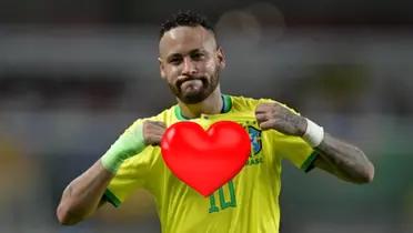 Neymar celebrates his goal fro brazil by showing off his shirt.