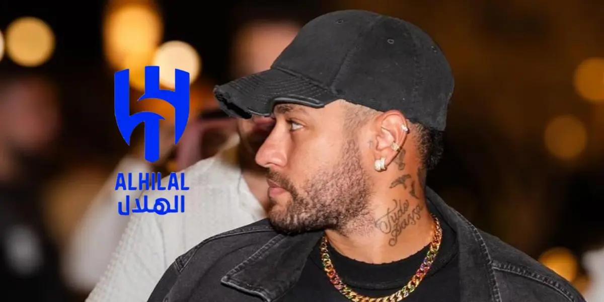 Neymar Jr. wears a hat in Saudi Arabia with a chain and the Al Hilal badge is next to him.