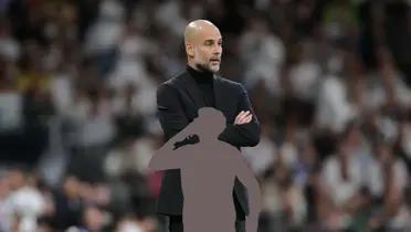 Pep Guardiola focused as the coach of Manchester City.