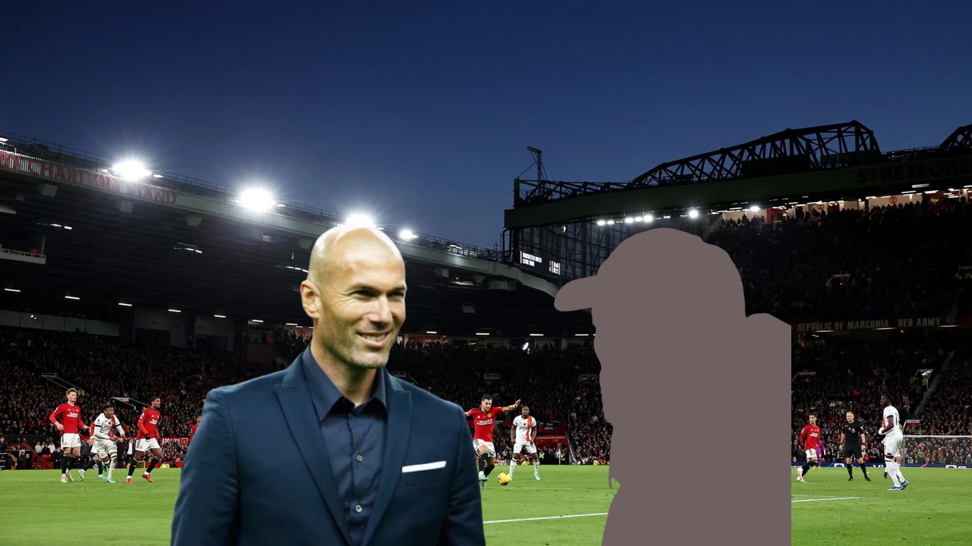Zinedine Zidane smiling with the background of Manchester United's stadium Old Trafford.